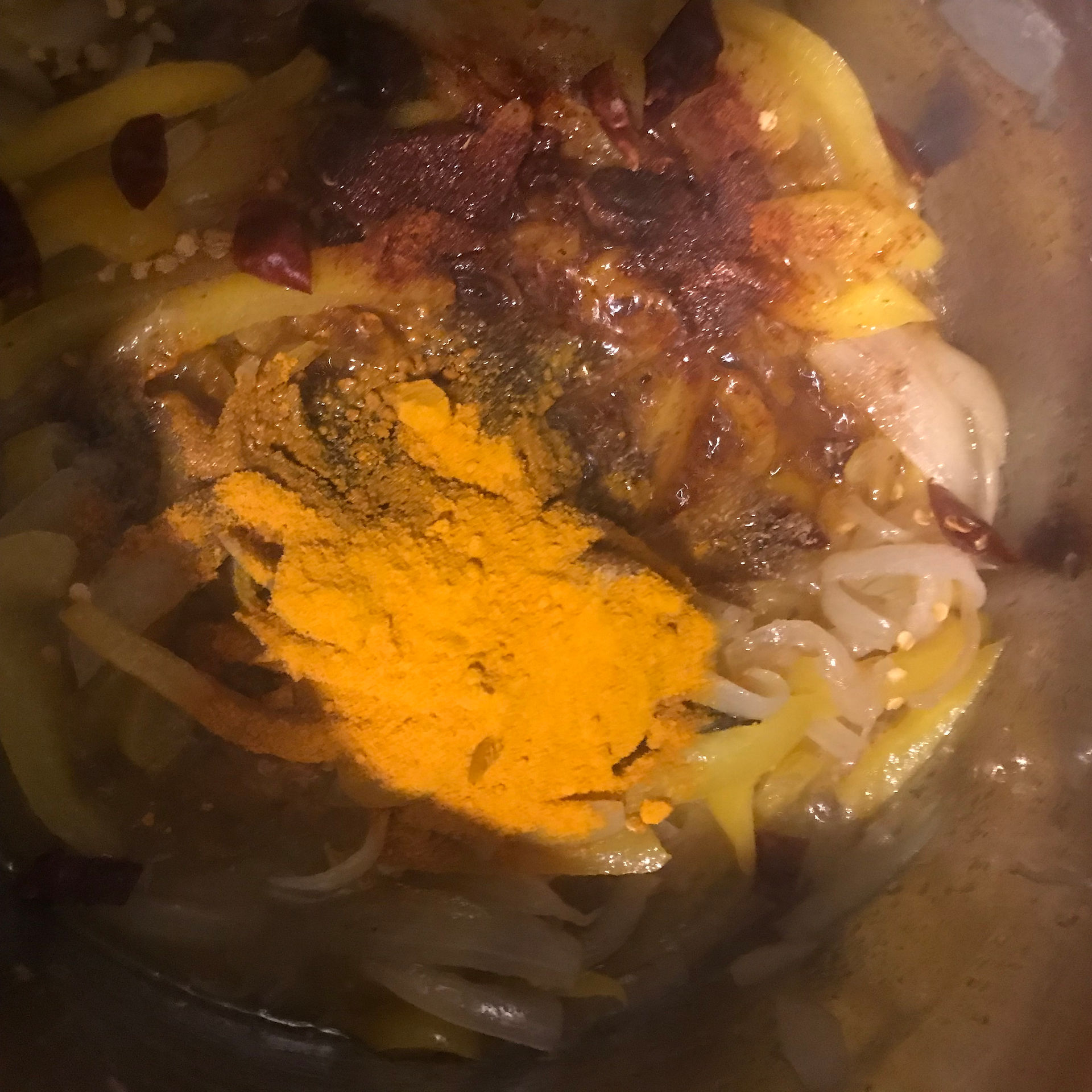 Once the bell pepper softens, add all of the dry spices