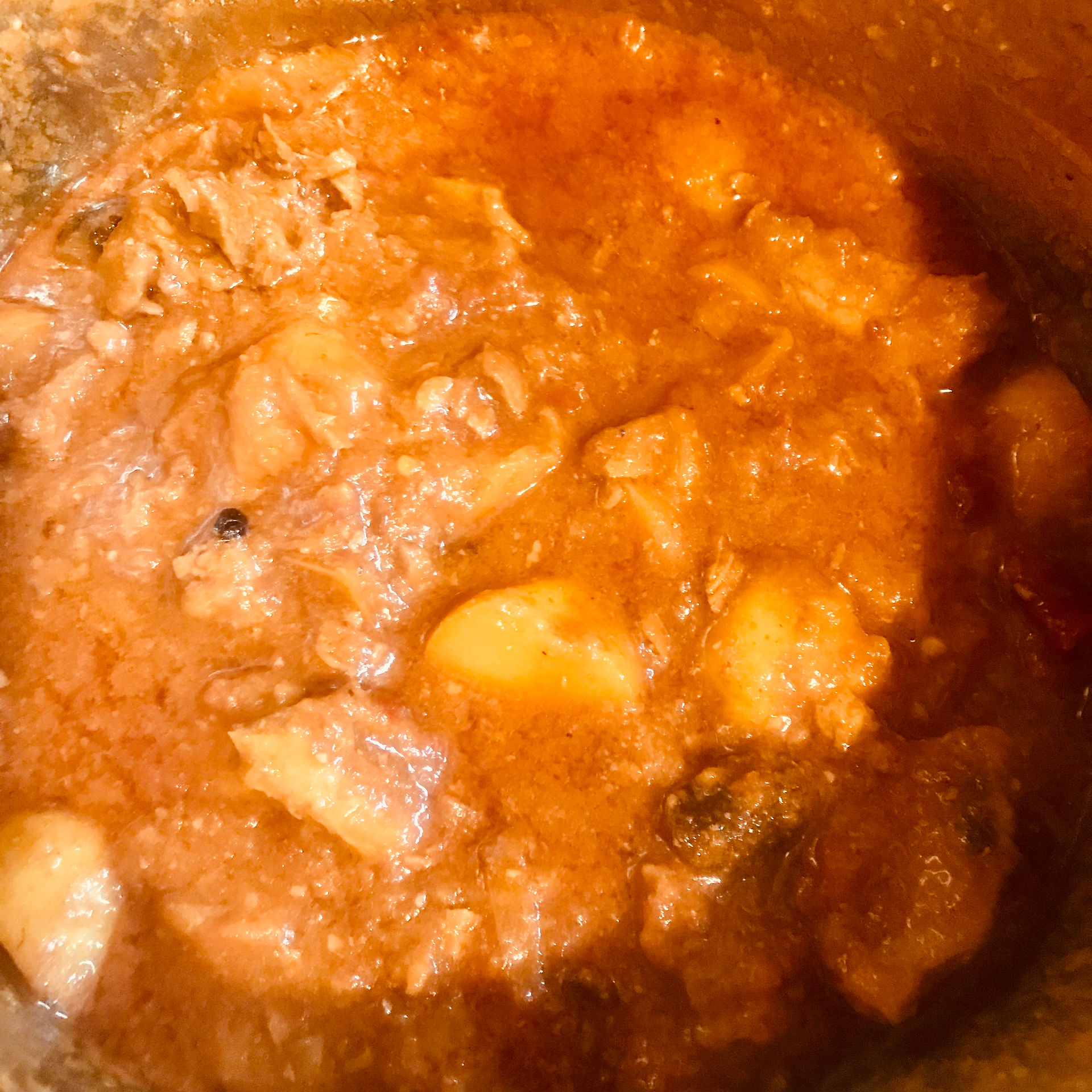 Simmer on a low heat until the gravy is thick and the lamb and potatoes are "fork flaky"
