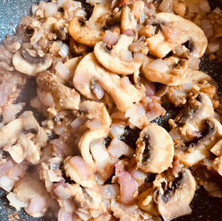 Add the mushrooms and sauté together with the shallot and spices until soft