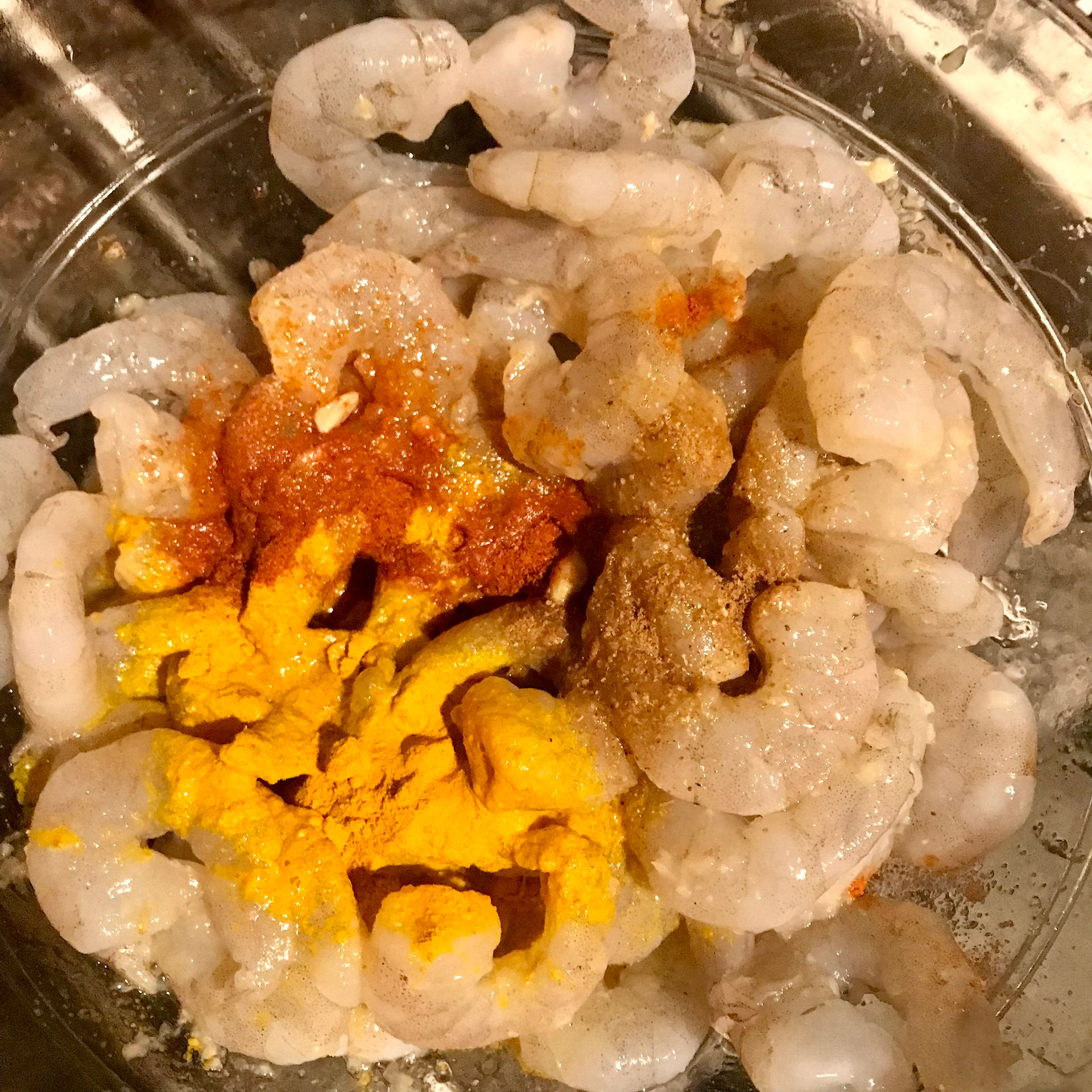 mix the spices into the king prawns