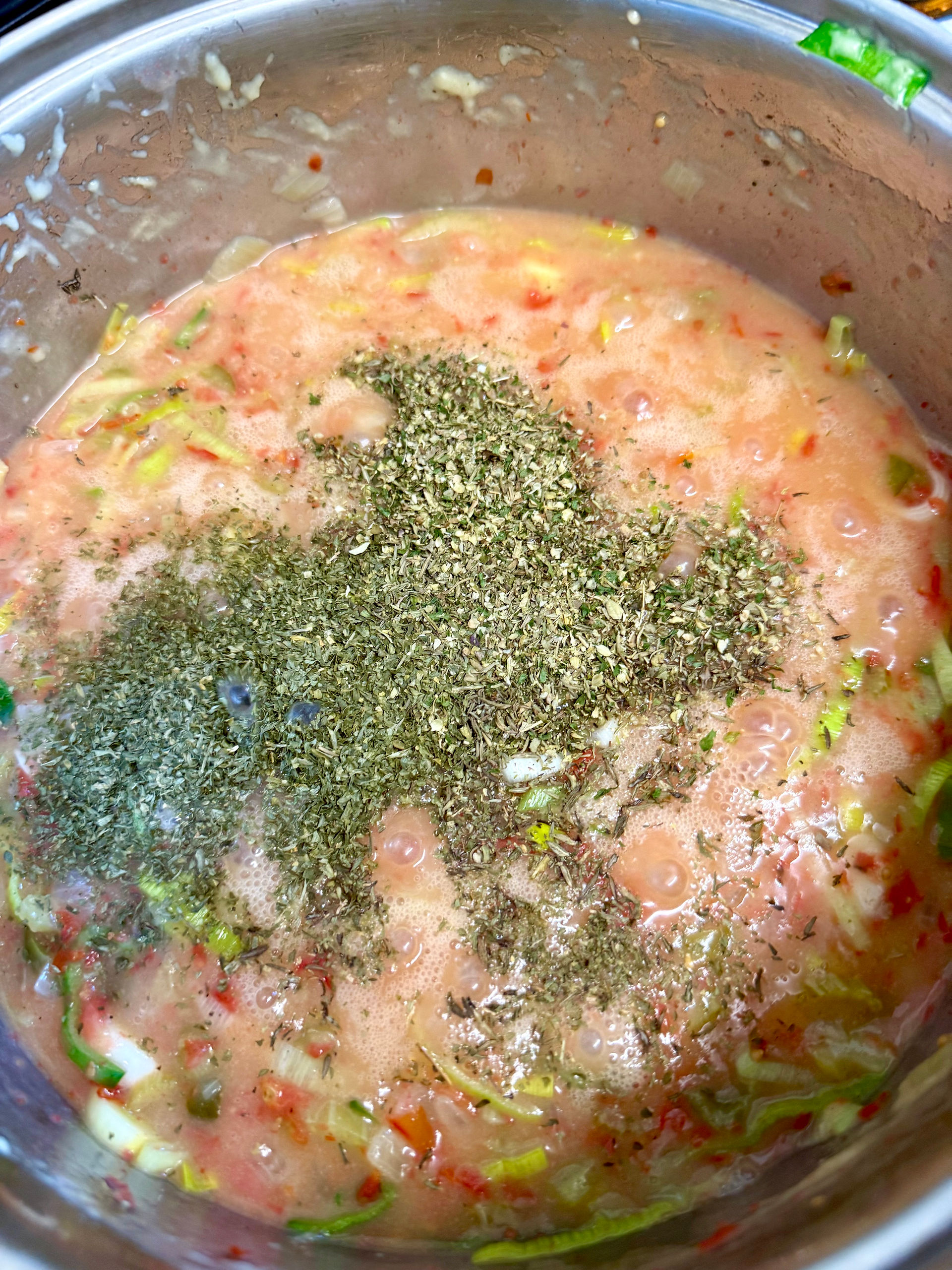 After about 5mins, add the mixed herbs and fold in