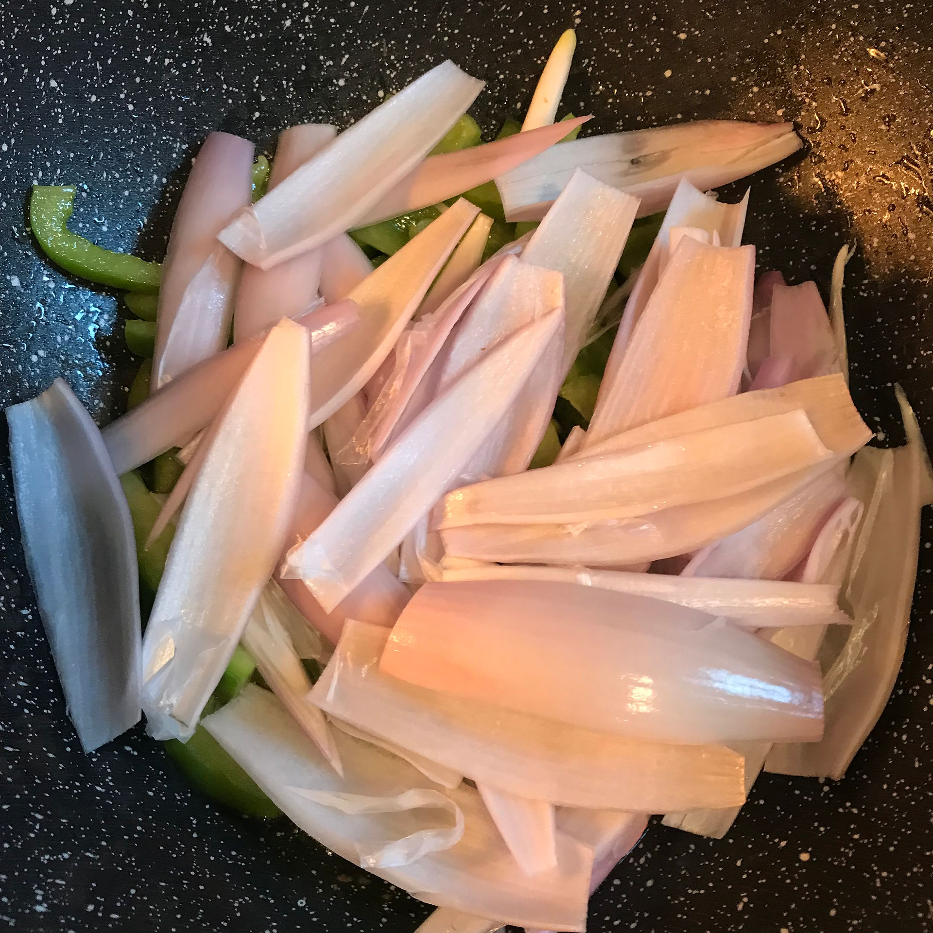 When the green bell pepper softens add the shallots