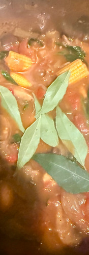 Once the vinegar and sugar have cooked in, add the curry leaves