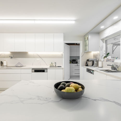 A high end polyurethane kitchen with marble benchtops, wardrobes and pantry renovation at Dover Heights manufactured and installed by Sydney's leading joinery contractor GB Interiors. 
