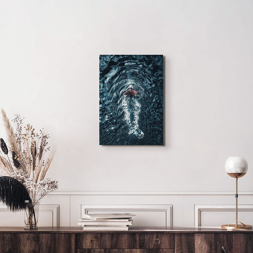 Thumbnail: Print of a sperm whale tail, hung above a side table
