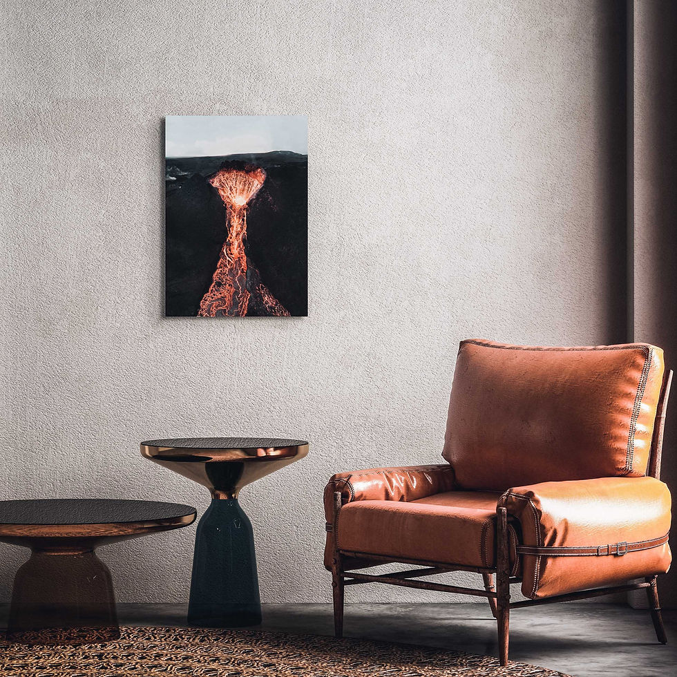 Thumbnail: print of an active volcano crater, with flowing lava, hung above an armchair