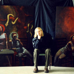 Claude Marquis artist portrait with Adam and Eve and Eve paintings, Ottawa Canadian painter Claude Marquis with his artwork