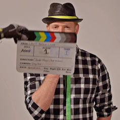 : Behind-the-scenes photo of Claude Marquis on set for “Don’t Believe In Love.”