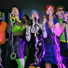 Live performance photo of The PepTides at The Mercury Lounge, documented by Claude Marquis, showing the band performing on stage in a concert setting.