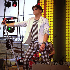 Claude Marquis performing on stage at Festival d’été de Québec 2017 with The PepTides.