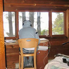 Claude MarQuis recording music inside a cabin on North Hero Island, Lake Champlain, Vermont.