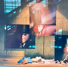Portrait paintings from Teflon Father series reflected in Holt Renfrew window glass