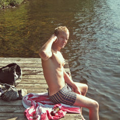 Claude MarQuis sitting on a dock at Meech Lake, Québec.