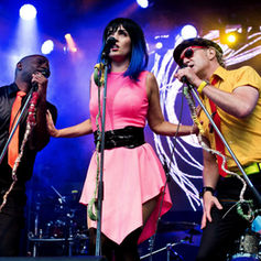 The PepTides performing live at Glowfair, documented by Claude Marquis, showing the band on stage during the festival performance.