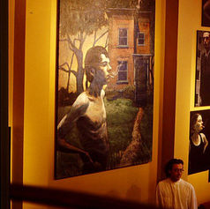 Claude Marquis with Worriers series portraits at Mercury Lounge bar Ottawa November 1996