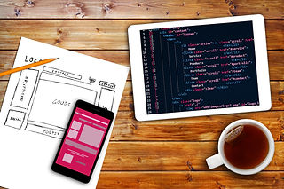 Website Wireframe Sketch And Programming Code On Digital Tablet.jpg