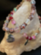 Thumbnail: Picture of red and pink Mother's day bracelets