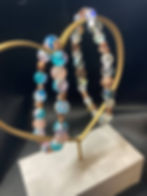 Two bracelets with rose gold hearts