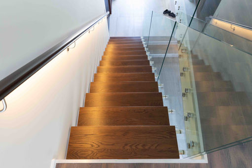 Wooden treads on this steel staircase add to the modern interior design.