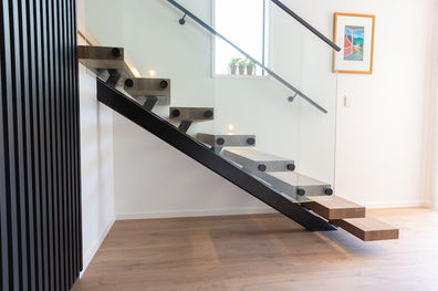 A side view of the small, 8 step staircase that Stairworks built as an addition to a preexisting staircase. 
