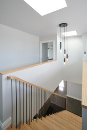 By hiding the fixings on the wooden treads, Stairworks was able to accomplish and clean and simple floating staircase design in this Auckland home.