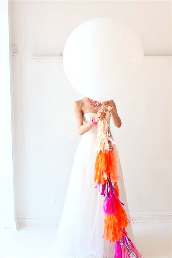 Thumbnail: pink tassels on white balloon