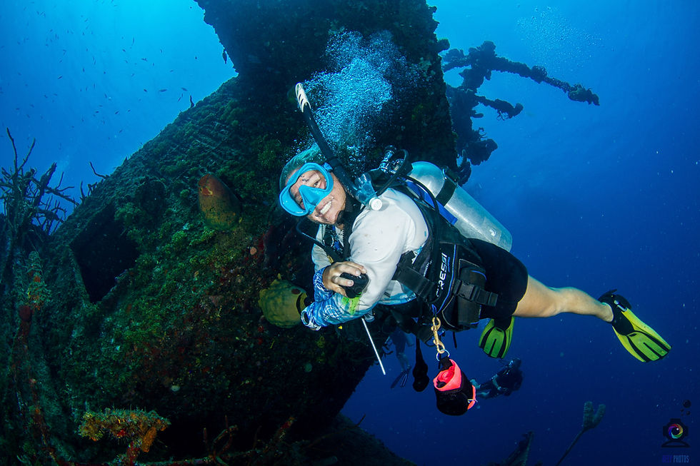 Scuba diver exploring a coral reef in Roatán, Honduras