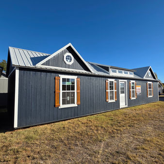 Derksen 16x50 cabin portable building interior showing framed walls and floor space, sold by Noble Portable Buildings in Texas