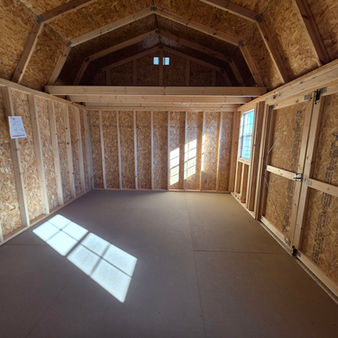 12x16 Side Lofted Barn interior view of dual lofts and wall studs by Derksen, sold by Noble Portable Buildings in Texas