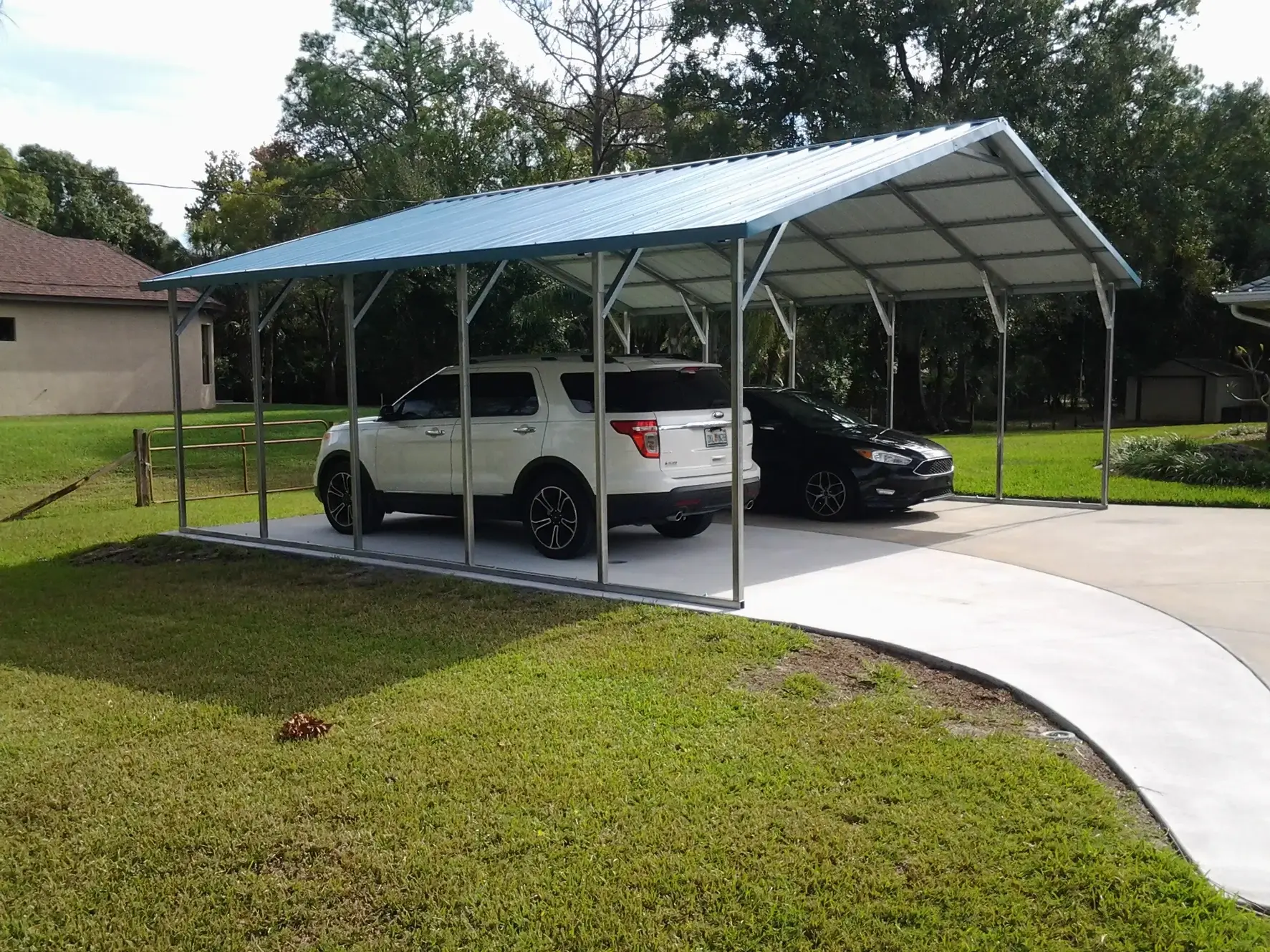 “Two-car vertical roof carport with reinforced steel frame”