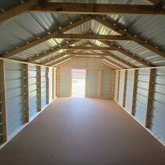 Interior of a Derksen Economy Metal Utility Shed showing spacious storage area and steel roof