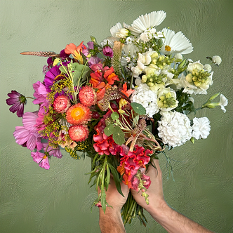 Lush garden bouquet of colorful flowers arragened in ombre color blocking grown on Kauai, Hawaii