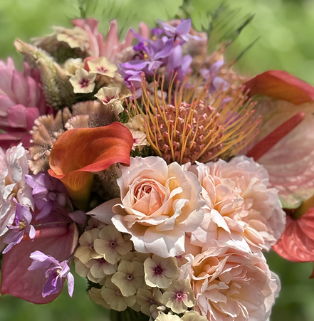 Hawaiian tropical wedding bridal bouquet pink and blush with protea, roses, calla lily, and anthurium.