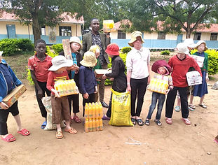 Albino kids with food purchased.jpeg