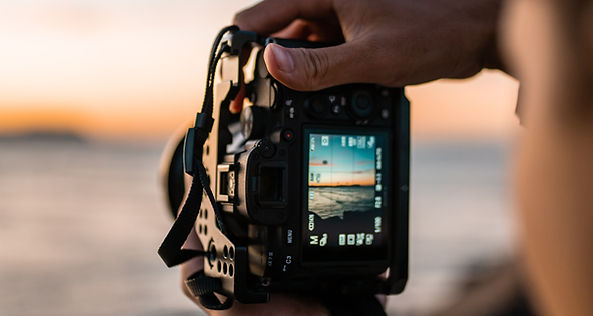 Close-up of man taking pictures with his