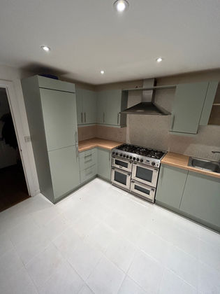 a kitchen wraped in sage green in Melbourne
