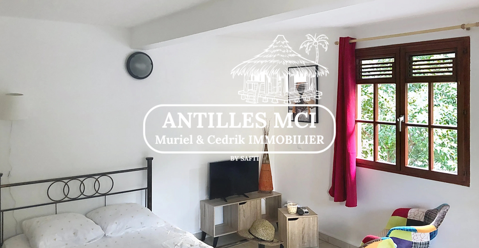 Chambre principale dans l’immeuble à Sainte-Anne – Antilles MCI