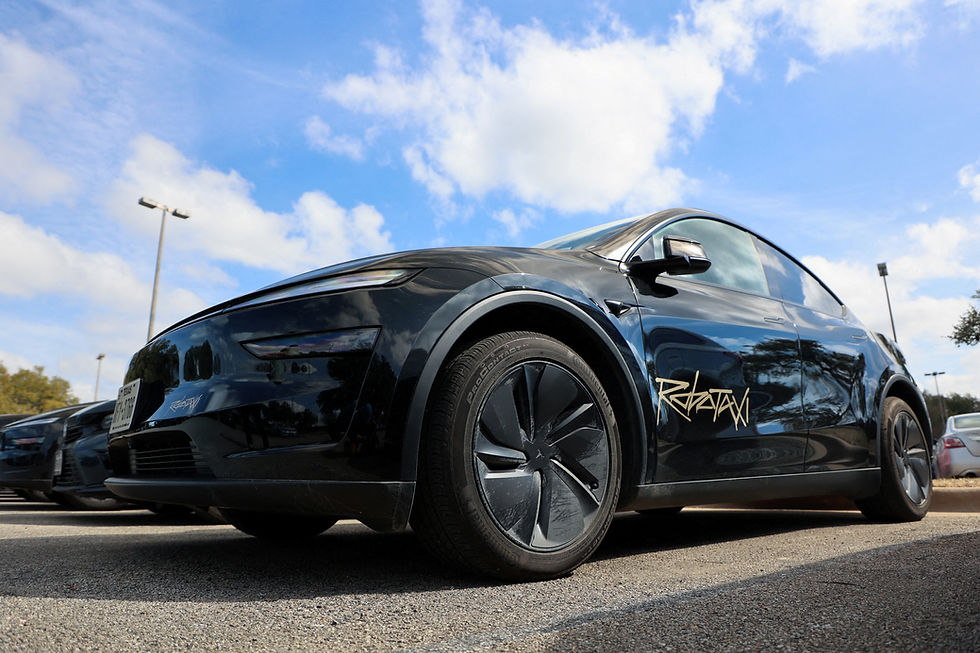 Tesla tones down optimism on robotaxis