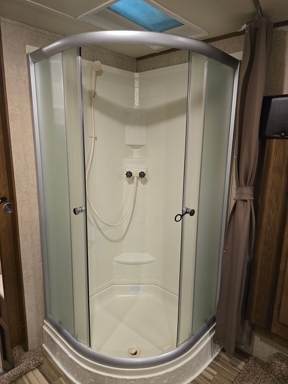 Corner shower at edge of bedroom