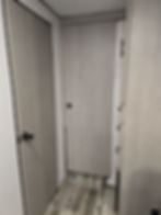 Doors to bathroom & rear bunk room