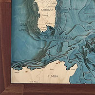 Detail of a clean-lined architectural wood frame corner on a handcrafted coastal map