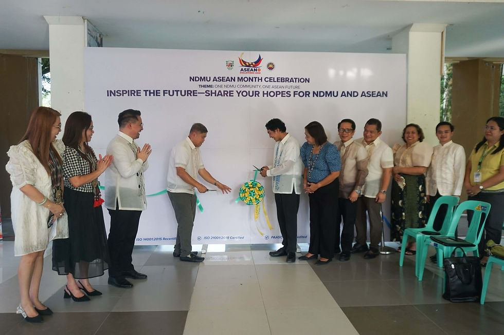 Administrators, guests, and students open the ASEAN Wall of Commitments and write messages of support for ASEAN unity, cooperation, and regional solidarity.