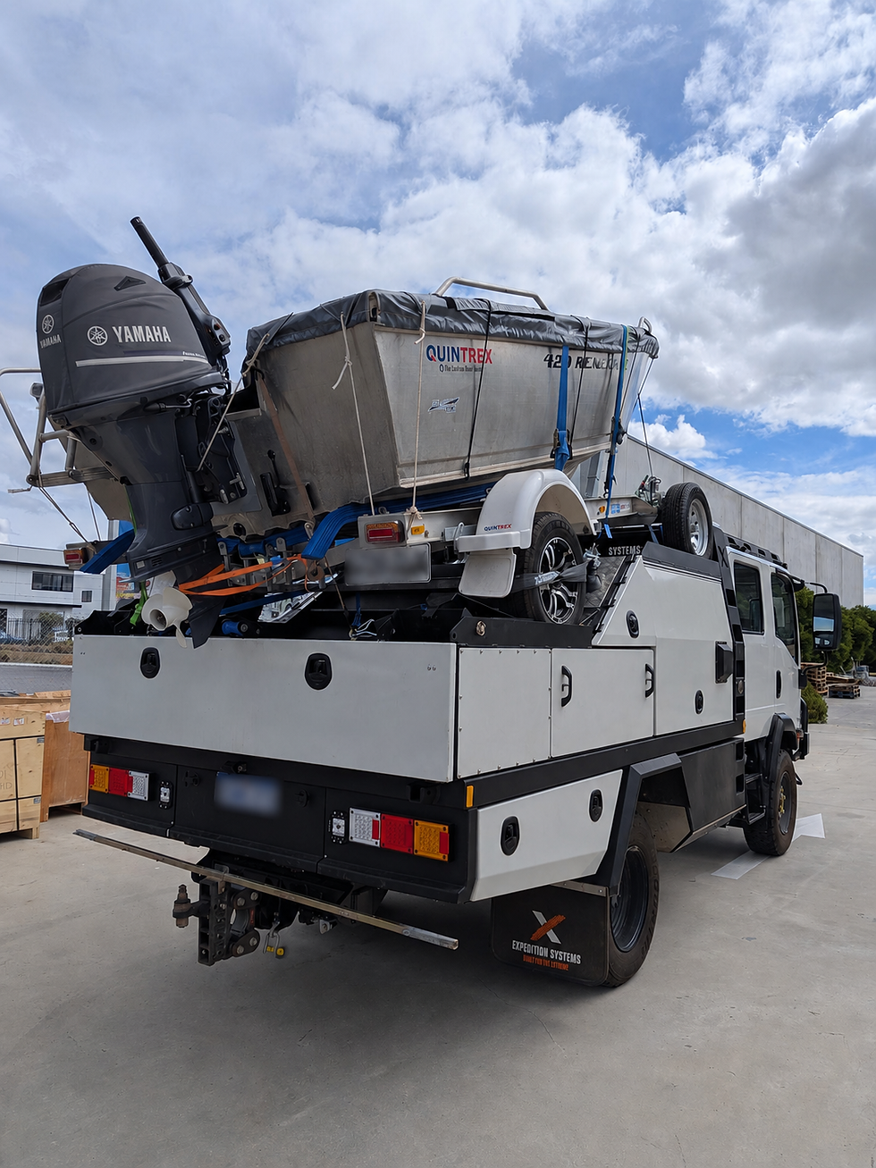 Rear view of a completed Isuzu NPS truck fitted with super-single rear wheels