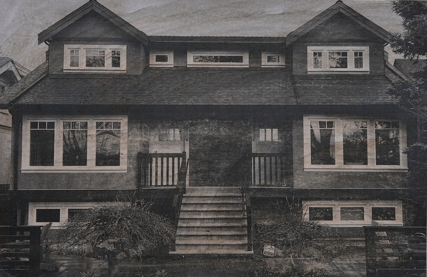 A black-and-white photo of a house in Vancouver, Canada
