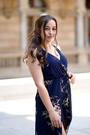 Woman posing for an elegant outdoor portrait in Prague