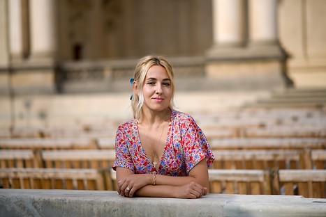 Elegant lifestyle portrait of a woman in Wallenstein Garden, Prague