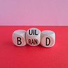 Build your brand symbol. Turned wooden cubes and changed the word 'build' to 'brand'. Beau