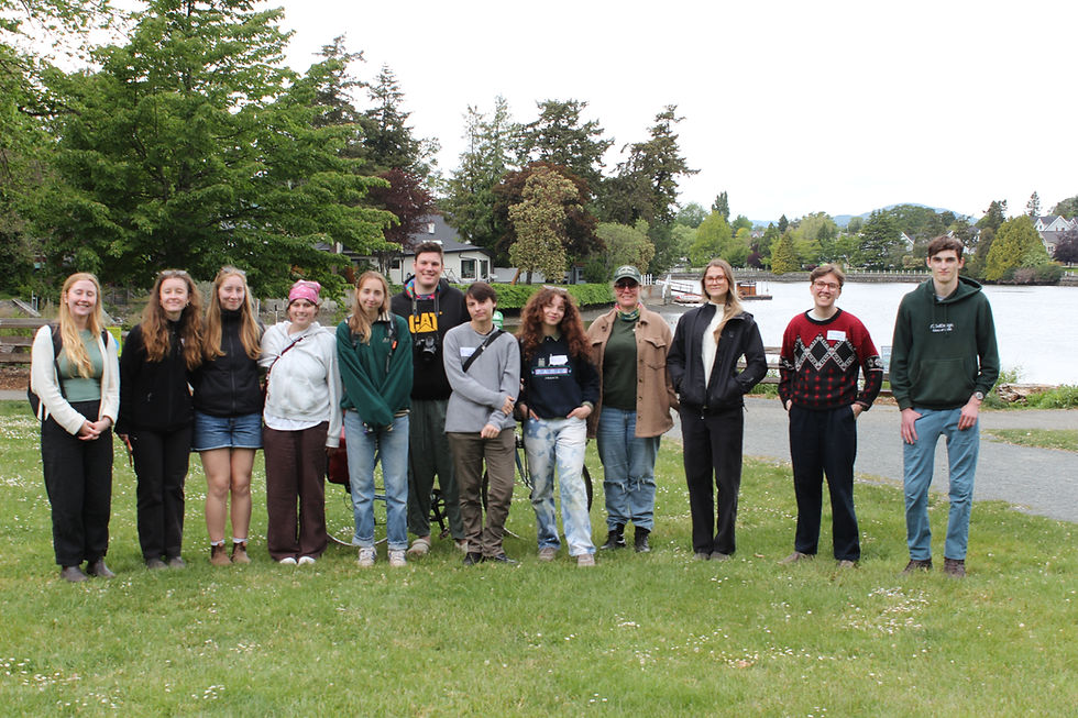 Stephanie Gurney and Madi Haller stand with 10 of the 11 Canada Summer Jobs hires in Esquimalt Gorge Park. (The photo was taken by the 11th.)