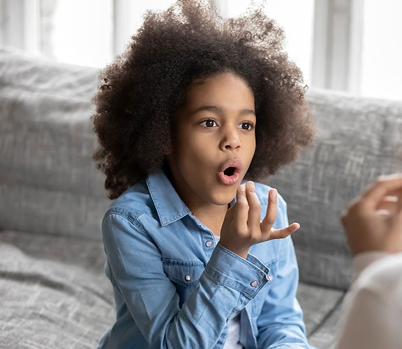 Elementary child in speech therapy for articulation disorder