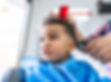 Toddler with sensory sensitivity getting a haircut after sensory processing therapy
